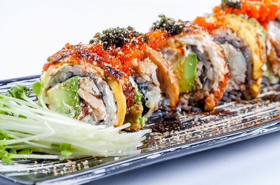 Dragon Roll - Real crab roll with avocado and unagi, topped with tobiko.